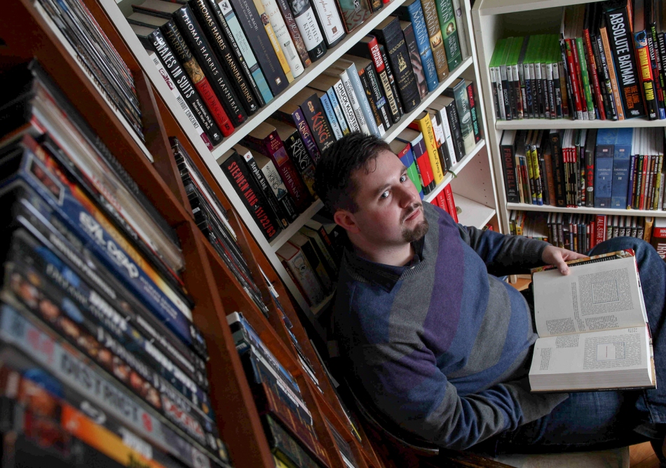 OTTAWA, Ont. (19/01/13) - Daniel Link a self-proclaimed 'collector of physical media' poses amongst his collection in his Ottawa, Ontario home on January 19. (Photo: Adam Dietrich)