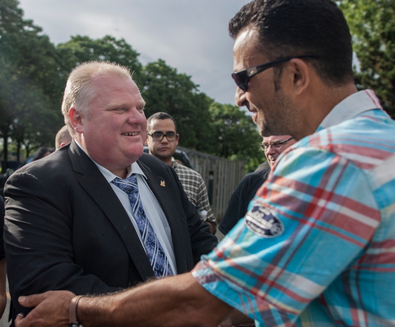 Mayor Rob Ford greets Aiman Abaujabeen at the annual Ford Fest BBQ on Friday, this year it was hosted at Thomson Park in Scarborough instead of Etobicoke. (July 5, 2013)
