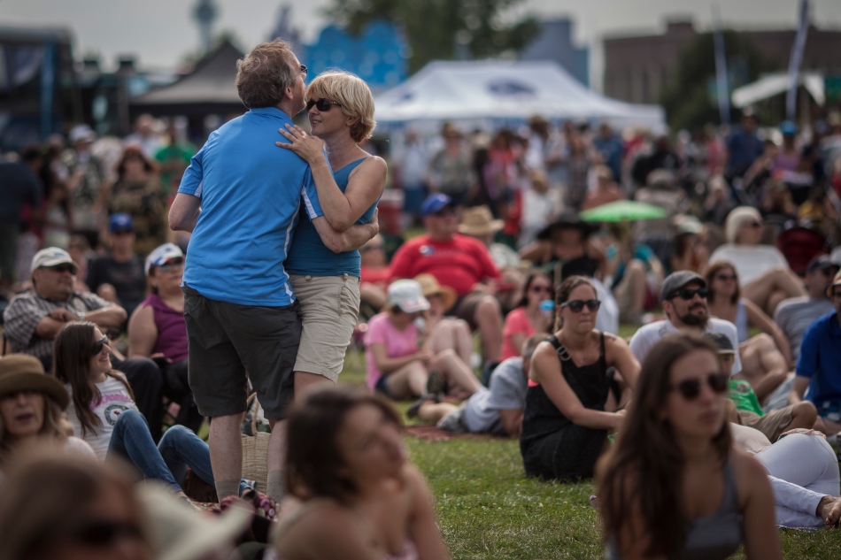 Jeff Boyd and Sarah Thomas dance during near the main stage of the Beaches International Jazz Festival on Sunday at Woodbine Park. (July 21,2013)