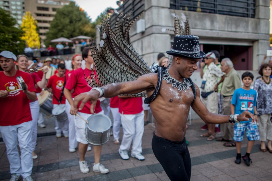 Danilo Rosa, a Samba dancer, leads a Samba performance on Sunday at the Latin Arts Festival in Mel Lastman Square.  Samba, which is native to Brazil, is hugely popular and features large marching drum bands, whistles and dancing with colourful costumes. (July 14, 2013)