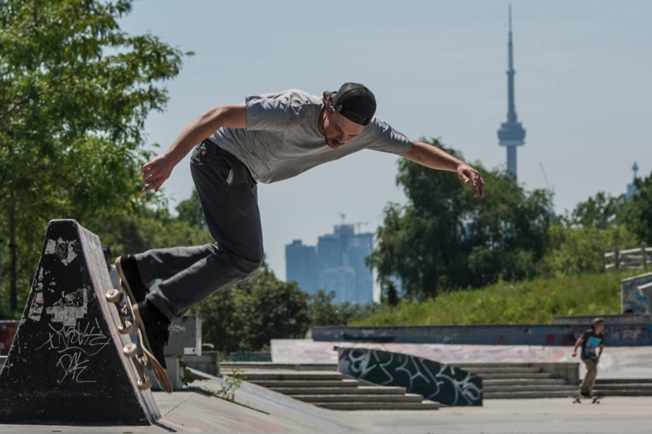 Phillip Daoust rides a wall on a sunny Saturday at Ashbridges Bay skate park. (July 13, 2013)