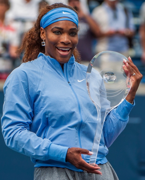 Serena Williams celebrates with the Roger's Cup after defeating Sorana Cirstea 6-2 6-0 in the women's single final at Rexall Centre on Sunday.  (August 11, 2013)