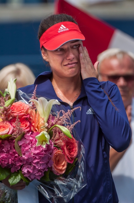 Romania's Sorana Cirstea wipes away tears after being defeated by America Serena Williams at the women's single final of the Rogers Cup at Rexall Centre on Sunday. (August 11, 2013)
