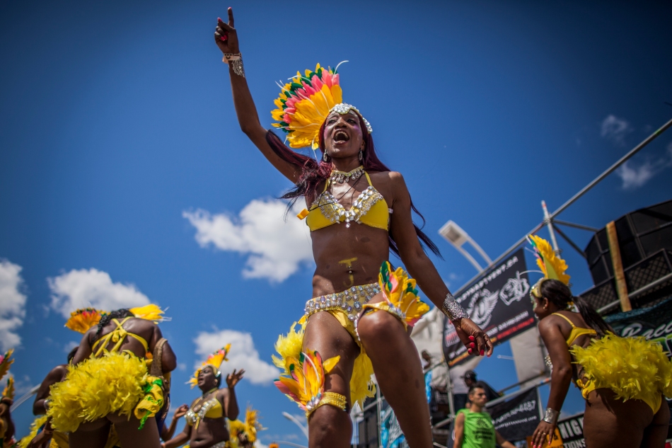 A masquerader performs on Lakeshore Boulevard on Saturday during the Grand Parade of the Scotiabank Caribbean Carnival. (August 3, 2013)