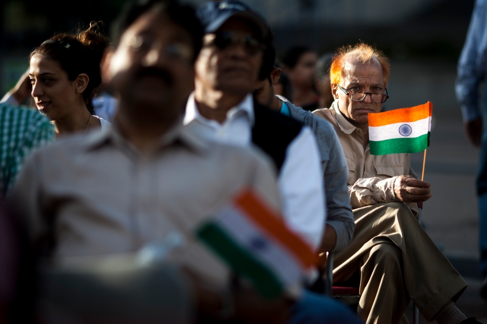 Yog Gulati holds an Indian flag outside Scarborough Civic Centre at the Hindu Cultural Society of Canada's celebration of India's Independence on Thursday. (August 15, 2013)