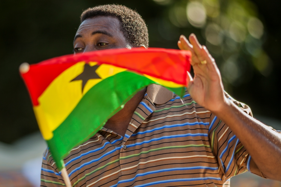 John Kamassa dances with a Ghanian flag at the second annual Canadian Ghanian festival of art an culture on Saturday in Earl Bales Park. (August 17, 2013)