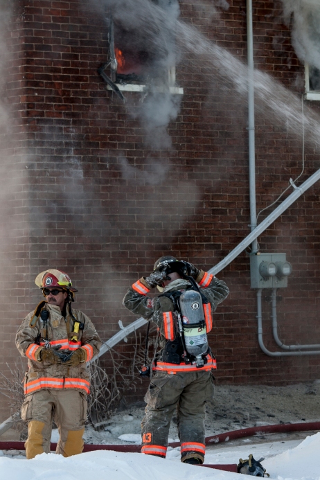 BELLEVILLE Ont. (3/1/14) - Fire crews work to douse a fire which sprung up in a two storey home on Grier Street in Belleville Ontario shortly before noon on January 3, 2014. (Photo Adam Dietrich)