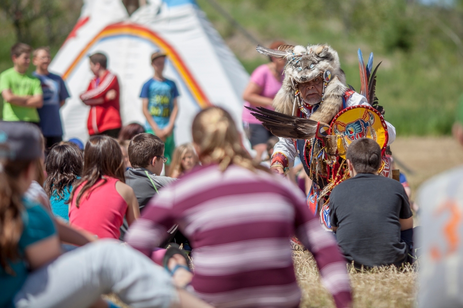 Elder Dave Matilpi performs a dance, in front of a crowd of Good Shepherd elementary school students, on the last day of the Sagitawa and DMI living tipi village at Misery Mountain ski hill in Peace River, Alta. on Thursday June 26, 2014. The event was meat to promote reading, literacy and awareness of Aboriginal history. Adam Dietrich | Record-Gazette/QMI Agency