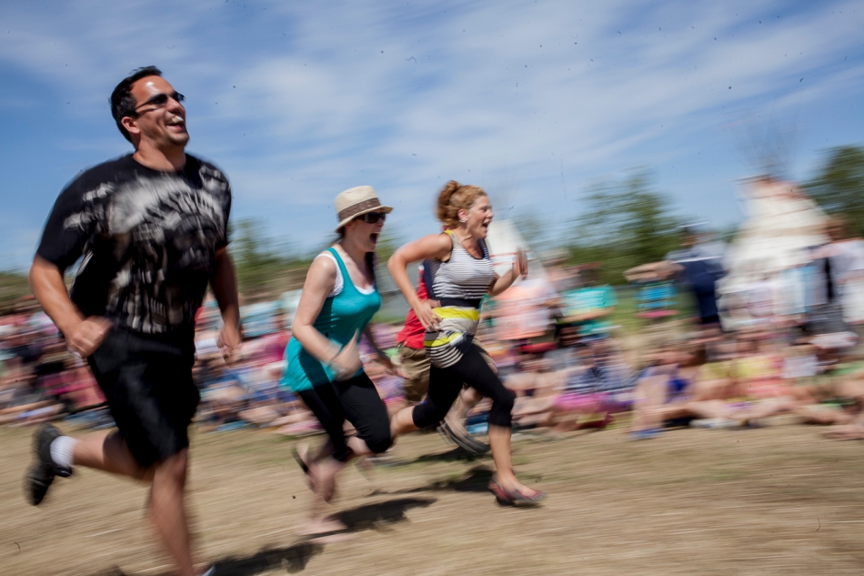 From left, Tyler Adamson, Brianna Thibault and Lisa Wedderburn participate in an event called 'Run and Scream,' which helps build endurance on the last day of the Sagitawa and DMI living tipi village at Misery Mountain ski hill in Peace River, Alta. on Thursday June 26, 2014. Adam Dietrich | Record-Gazette/QMI Agency