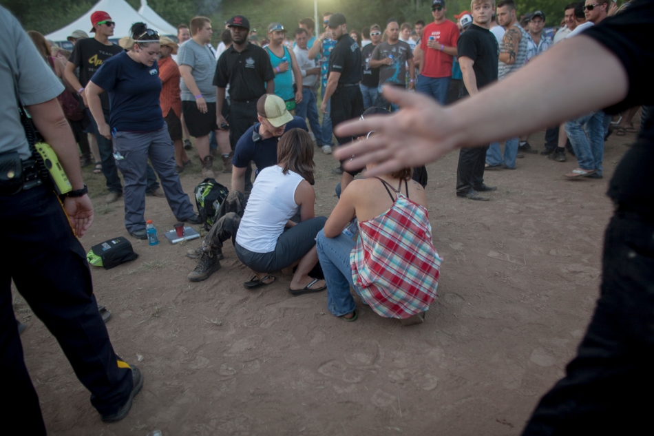 A security guard from Patman Productions is tended to after his leg was broken while trying to remove an unruly person from the Peace Fest beer garden on Saturday, July 12, 2014 in Peace River, Alta Adam Dietrich | Record-Gazette/QMI Agency