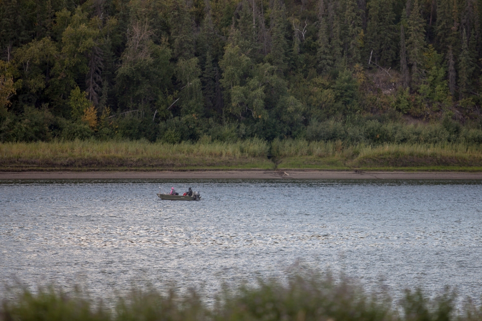 People in a boat fish in the Peace River on Tuesday afternoon in Peace River on Sept. 2, 2014. Adam Dietrich | Record-Gazette/QMI Agency